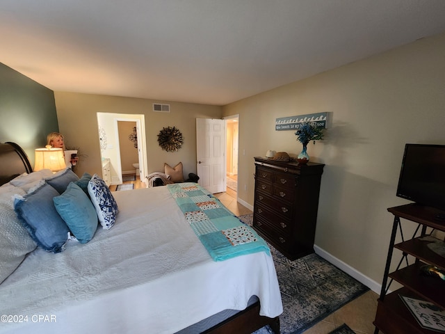 bedroom with connected bathroom