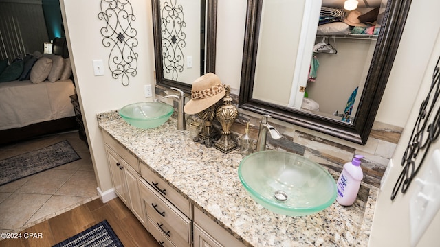 bathroom with vanity and wood-type flooring