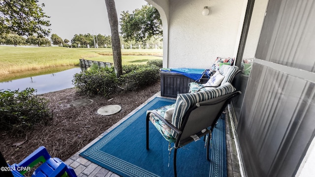 view of patio / terrace with a water view