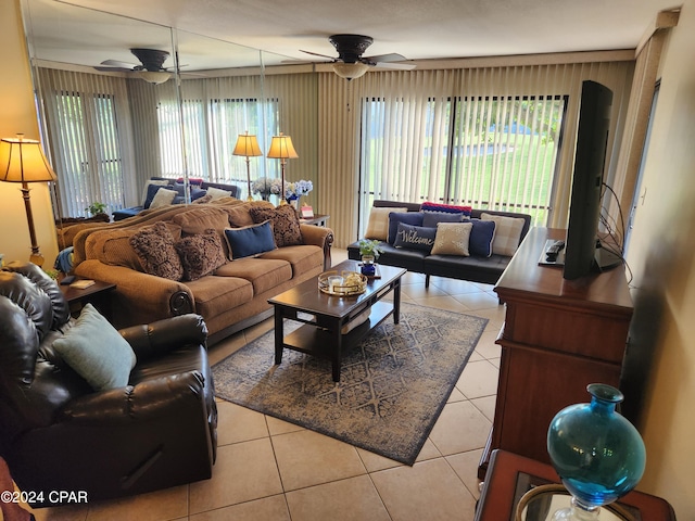 living room with ceiling fan and tile patterned flooring