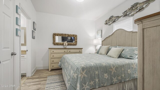 bedroom featuring light wood-type flooring