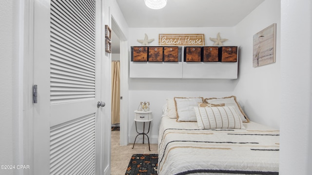 bedroom featuring light tile patterned floors