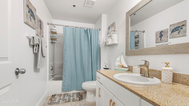 full bathroom featuring toilet, shower / bath combo with shower curtain, vanity, and tile patterned flooring