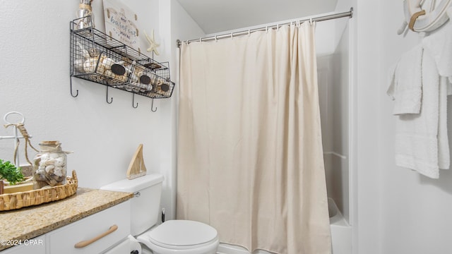 full bathroom with shower / tub combo with curtain, vanity, and toilet