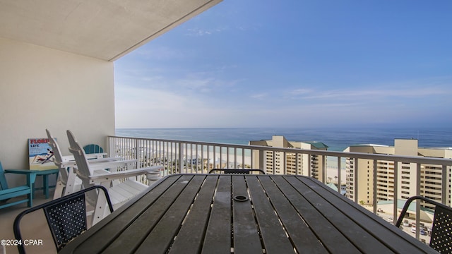 deck with a beach view and a water view