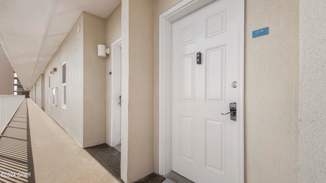 corridor featuring carpet flooring