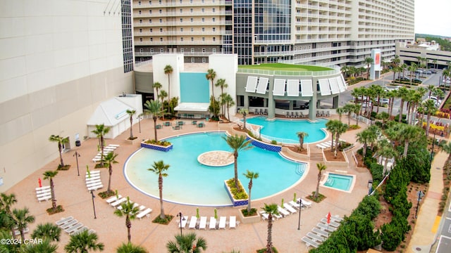 view of swimming pool with a patio