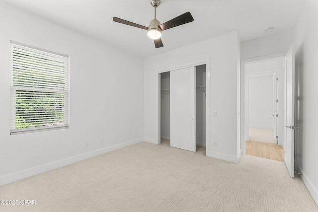 3502 Fox Run Blvd, Panama City, FL 32408 - unfurnished bedroom with baseboards, light colored carpet, a closet, and a ceiling fan