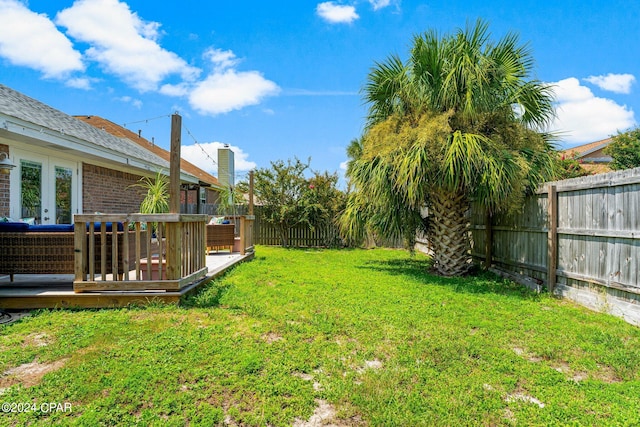 view of yard featuring a wooden deck