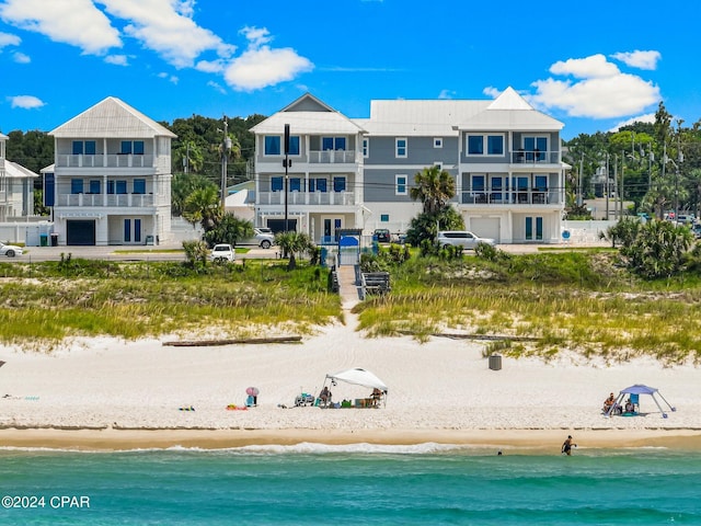 bird's eye view featuring a water view and a view of the beach