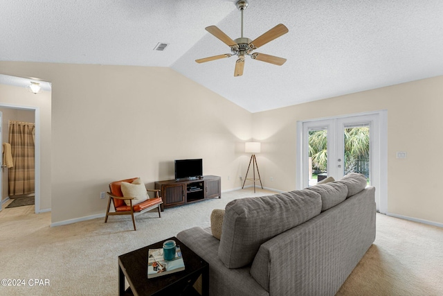 living room featuring light carpet, ceiling fan, french doors, and lofted ceiling