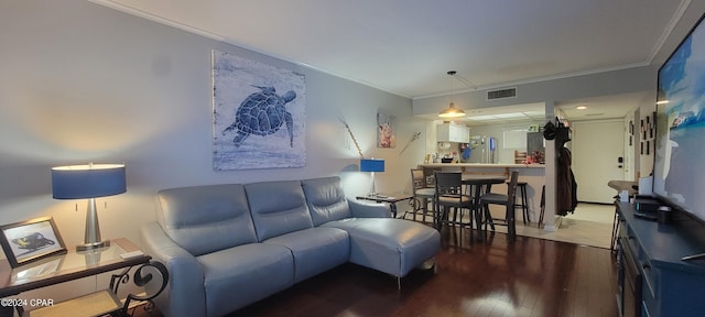 living room featuring ornamental molding and hardwood / wood-style floors