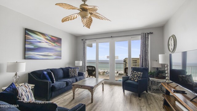 living room with hardwood / wood-style floors and ceiling fan