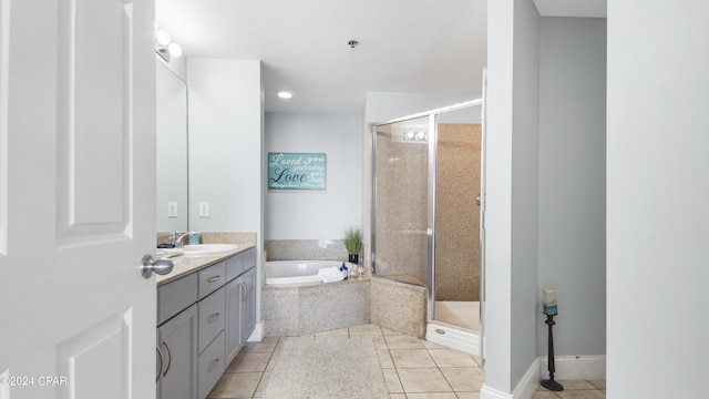 bathroom featuring a shower stall, a bath, vanity, and tile patterned flooring