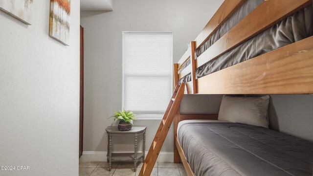 bedroom featuring light tile patterned flooring