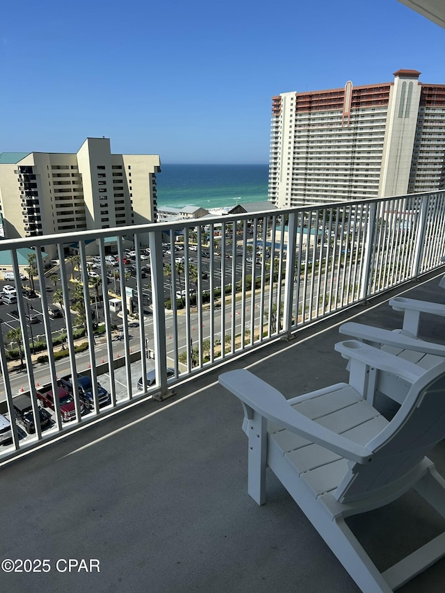 balcony featuring a water view