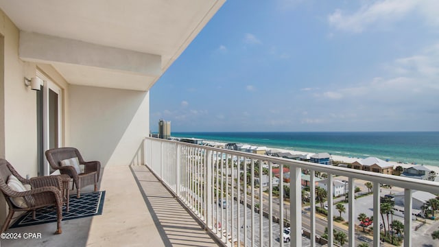 balcony featuring a water view