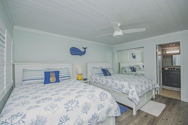 bedroom with ensuite bathroom, crown molding, a closet, ceiling fan, and hardwood / wood-style floors