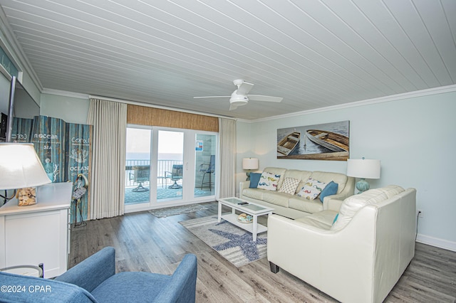 living room featuring crown molding, ceiling fan, and hardwood / wood-style flooring