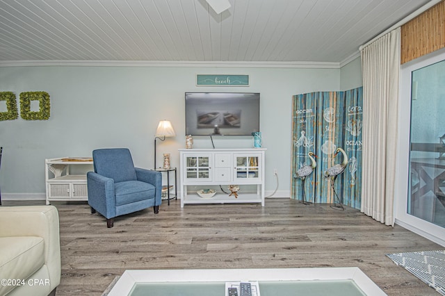 sitting room featuring crown molding, hardwood / wood-style floors, and wood ceiling