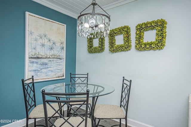 dining room featuring ornamental molding and an inviting chandelier