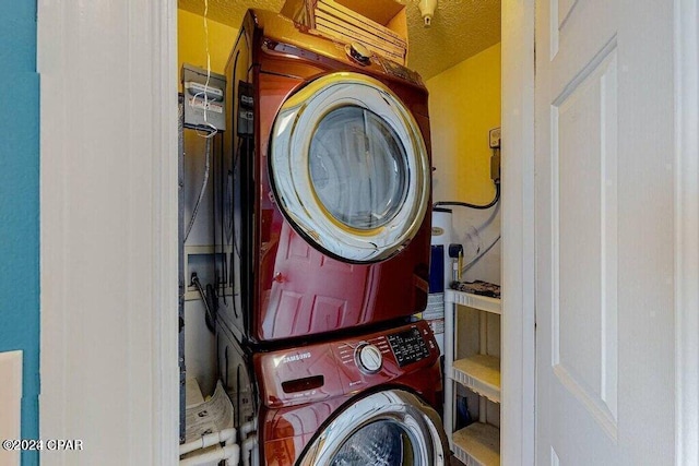 washroom with stacked washer / dryer