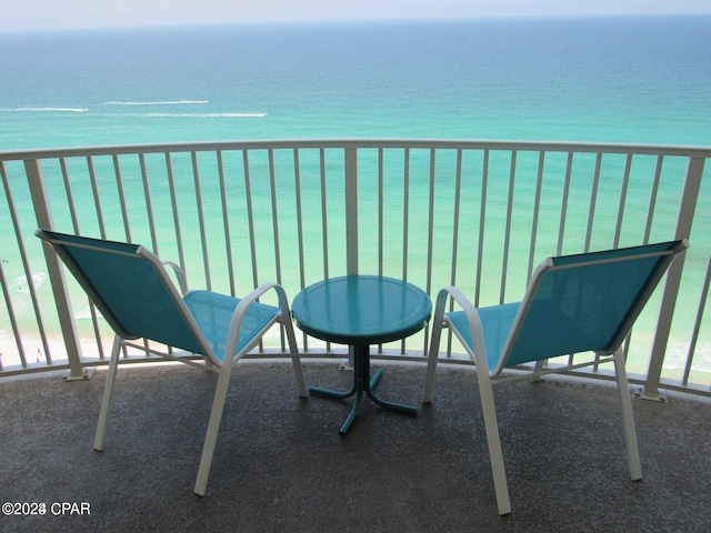 balcony featuring a water view