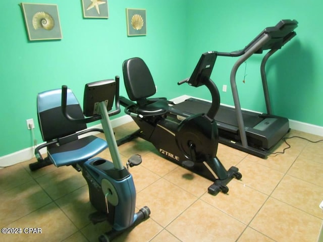 workout room featuring light tile patterned floors