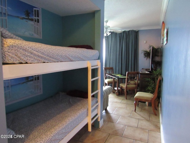 bedroom featuring light tile patterned flooring and ornamental molding