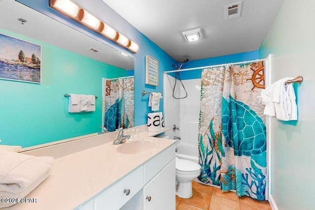 full bathroom with shower / tub combo with curtain, tile patterned flooring, vanity, and toilet