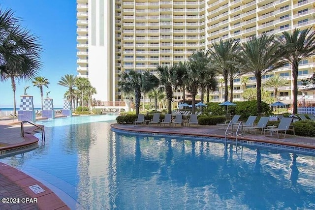 view of swimming pool with a patio