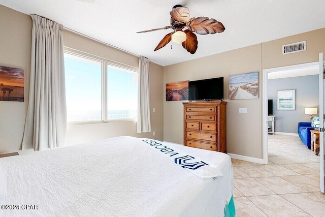 tiled bedroom with ceiling fan