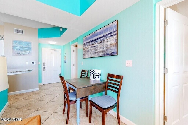 dining space with light tile patterned floors