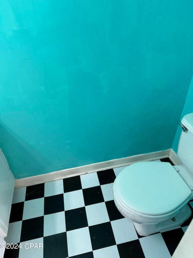 bathroom featuring tile patterned floors and toilet