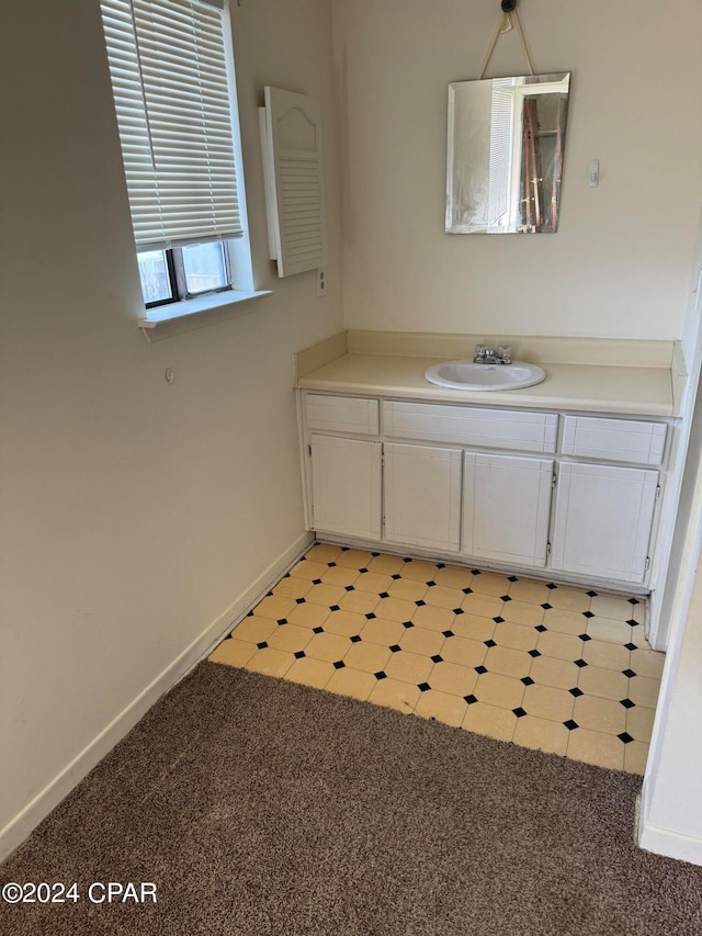 bathroom featuring tile patterned floors and vanity