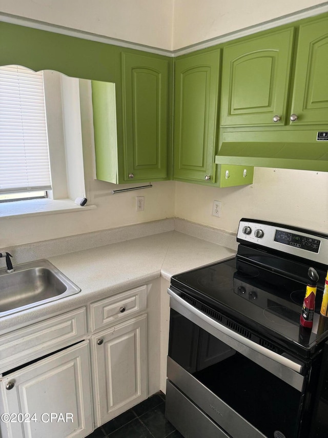 kitchen with custom exhaust hood, green cabinetry, sink, and stainless steel electric range oven