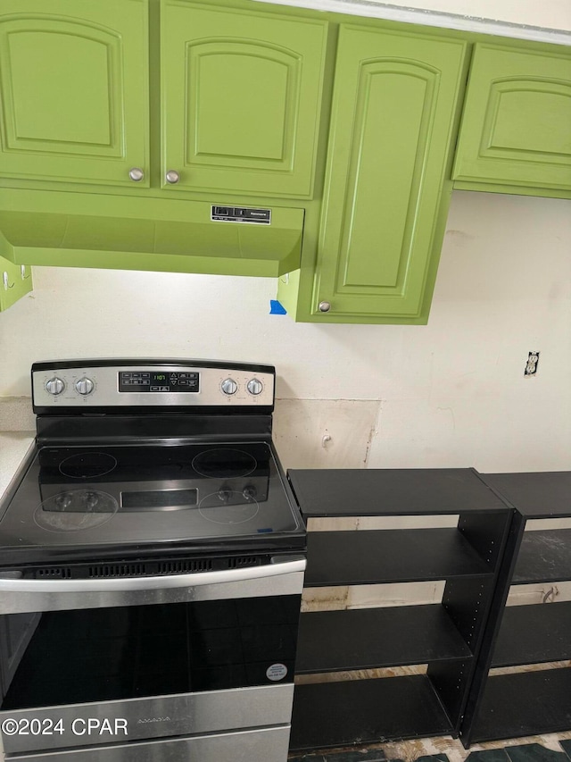 interior space featuring green cabinetry and stainless steel electric range