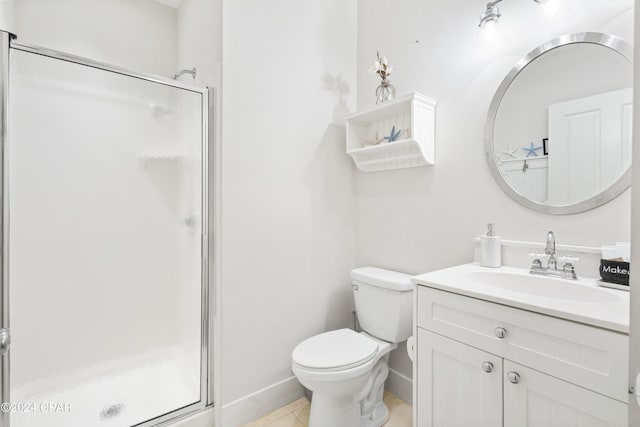 full bathroom featuring toilet, a shower stall, vanity, tile patterned flooring, and baseboards