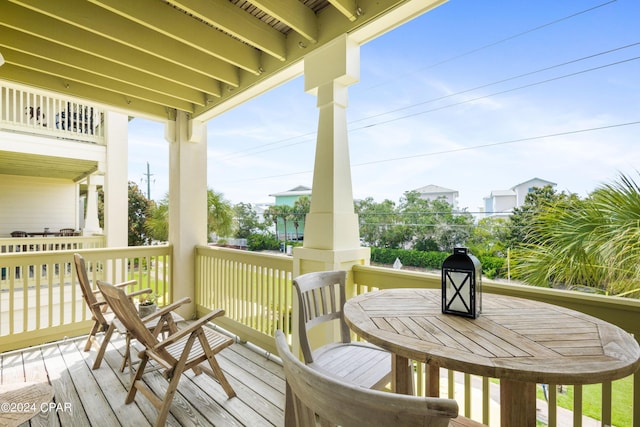 wooden deck featuring outdoor dining space