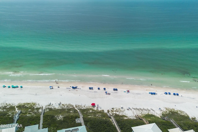 birds eye view of property with a view of the beach and a water view