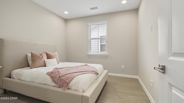 bedroom with light hardwood / wood-style flooring