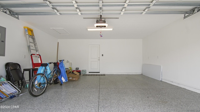 garage featuring a garage door opener and electric panel