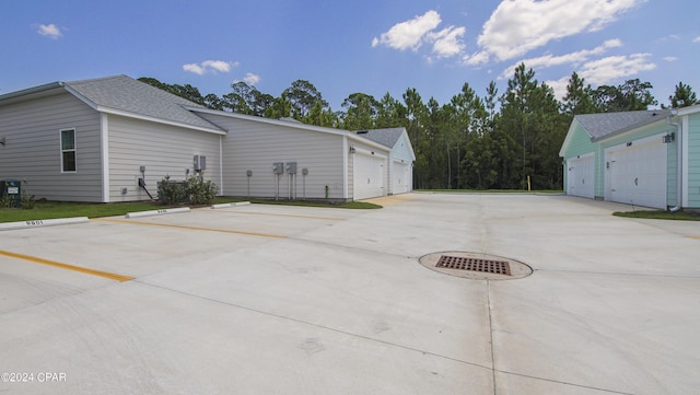 view of side of home with a garage