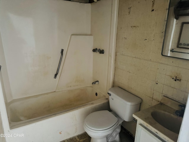 full bathroom featuring bathing tub / shower combination, toilet, and vanity