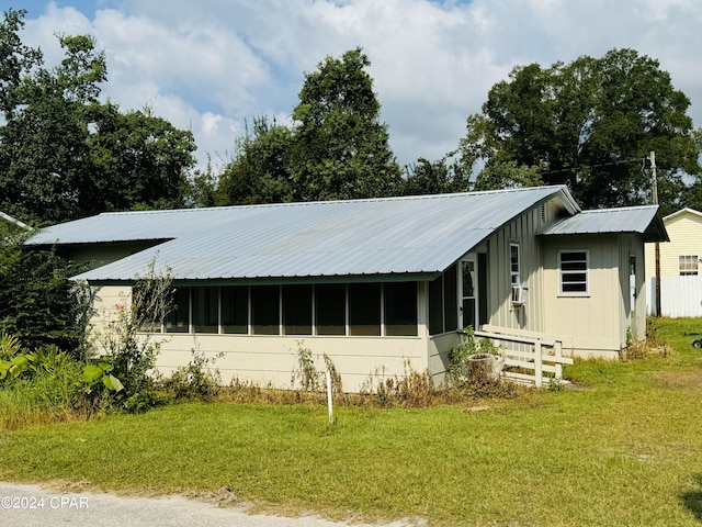 exterior space featuring a front lawn