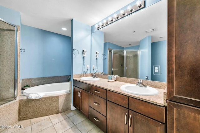 bathroom featuring tile patterned floors, separate shower and tub, and vanity