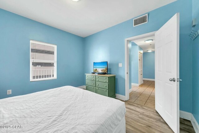 bedroom with light wood-type flooring