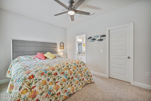 carpeted bedroom featuring baseboards, visible vents, ceiling fan, a textured ceiling, and connected bathroom