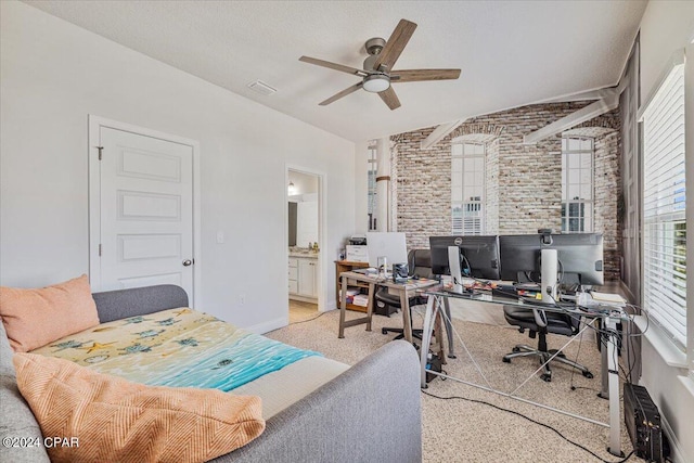 carpeted bedroom with visible vents, connected bathroom, brick wall, baseboards, and a ceiling fan