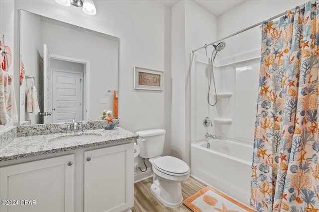 full bathroom featuring toilet, wood finished floors, shower / tub combo, baseboards, and vanity